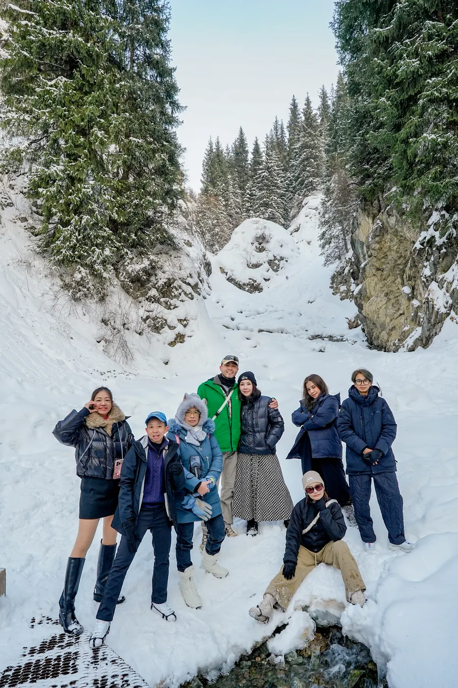 A group in a snowy mountain gorge
